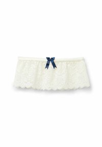 Vit spets stretchband med vågiga kanter och en marinblå ripsbandsslips i mitten. Mjuk textur med intrikata mönster.
