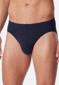 Herrenboxershorts in Marineblau aus weichem, elastischem Material. Mit einem tief sitzenden Bund und nahtlosem Design für Komfort und Unterstützung.
