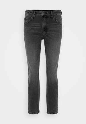 Ciemnoszare dżinsy z prostą nogawką, przednimi kieszeniami oraz zapięciem na zamek z guzikowym zamknięciem. Minimalistyczne detale wyszycia.