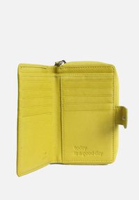 Yellow leather wallet with a zip closure, multiple card slots, and embossed text saying "today is a good day." Smooth texture, compact design.