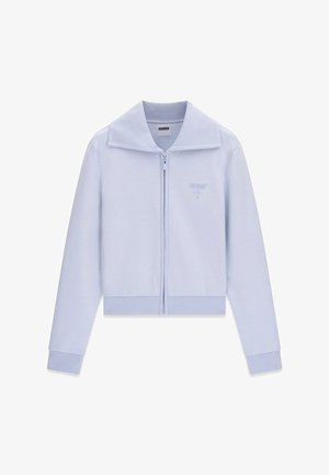 Light blue zip-up jacket with long sleeves, wide collar, ribbed cuffs and hem, and small embroidered Guess logo on the left chest.