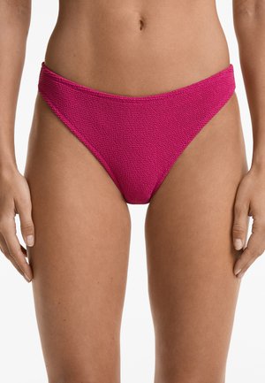 Magenta bikini bottom in textured knit fabric. Features low-rise cut with wide sides and minimal coverage, highlighting a smooth finish.