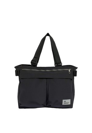 Sac fourre-tout rectangulaire noir avec deux poignées, poche zippée à l'avant et petit patch logo en bas à droite.