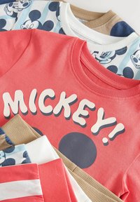 Collection of sweatshirts featuring various colors: coral with "MICKEY!" text, themed patterns in blue, white, and beige, ribbed cuffs.