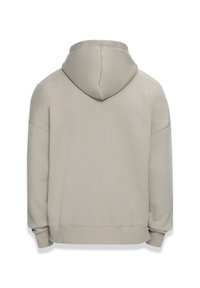 Hettegenser i lys beige, med avslappet passform, mykt stoff og ribbestrikkede mansjetter. Enkelt design uten synlige logoer eller mønstre.