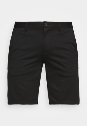 Juodos trumpesnės kelnės, pagamintos iš lygaus, pralaidaus oro audinio, su mygtuko uždarymu, dirželio kilputėmis ir tiesia kojų forma.