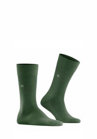 Calzini in cotone verde con orlo a coste, altezza media, texture liscia e dettagli del logo discreti di lato.