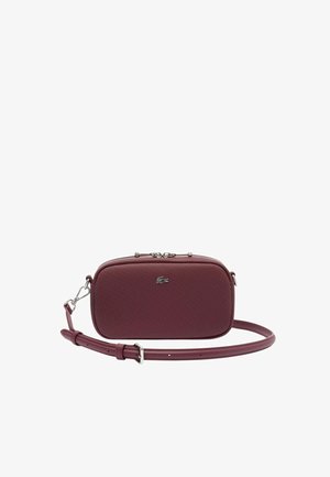 Maroon rectangular crossbody bag made of textured synthetic material, featuring a zipper closure and a detachable strap, accented with a logo.