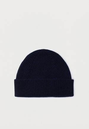 Navy blue ribbed knit beanie hat with folded cuff, displayed flat on a white background.