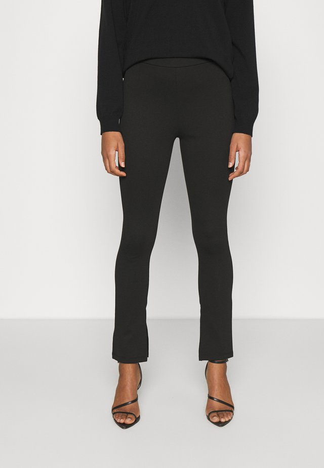 NA-KD X ZALANDO EXCLUSIVE  SIDE SLIT - Leggings - Hosen - black