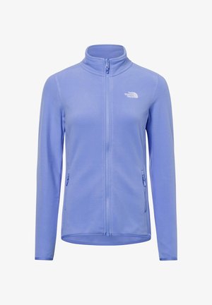 Jasnofioletowa polarowa kurtka z kołnierzem typu stand-up, pełnym zamkiem błyskawicznym z przodu i dwoma kieszeniami bocznymi na zamek. Posiada małe logo na klatce piersiowej.