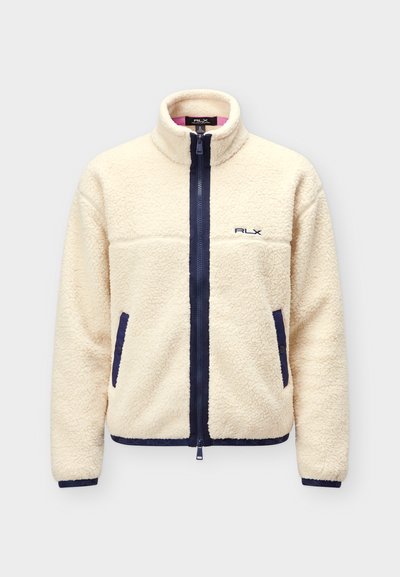 Μπουφάν sherpa fleece σε εκρού χρώμα με φερμουάρ σε ναυτικό μπλε, περιμετρικά στριφώματα τσεπών, ελαστικά μανσέτα και λογότυπο RLX στο στήθος.