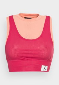 Pink and peach mesh sports crop top with a round neckline, sleeveless design, and a logo patch on the hem. Breathable fabric and fitted shape.