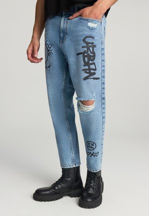 CON GRAFFITI E STRAPPI - Jeans Tapered Fit - blu denim medio