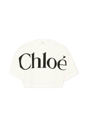 T-shirt court blanc avec logo noir "Chloé" surdimensionné imprimé sur le devant, manches courtes et col rond.