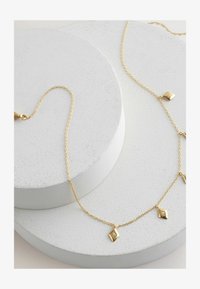 Kijelölve, gold plated sterling silver