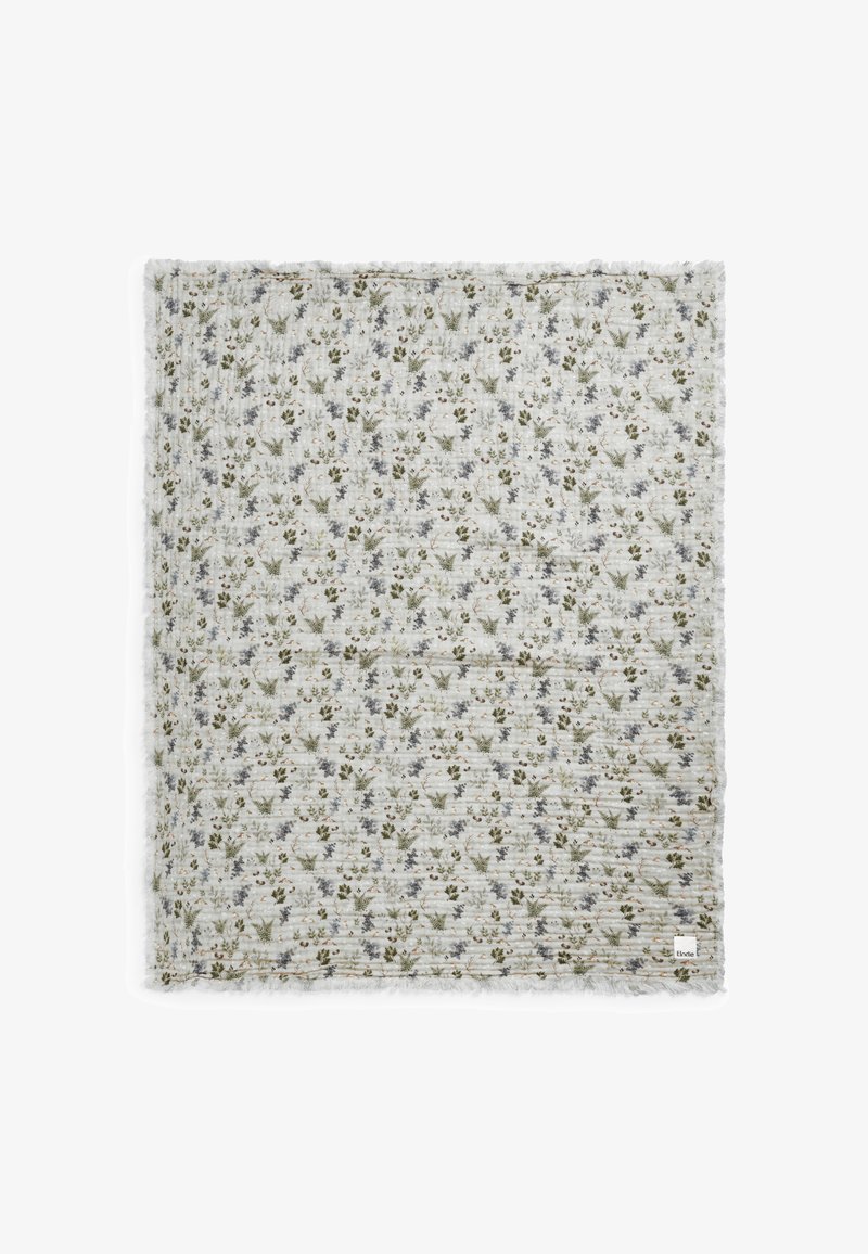 Coperta a motivi floreali con un tessuto leggero e strutturato. Fiori verdi, blu e marroni su uno sfondo color crema. Bordo frangiato. Forma quadrata.