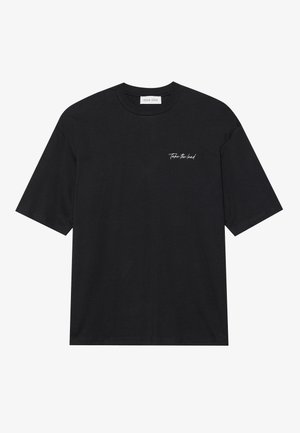 Black cotton t-shirt with short sleeves, featuring a white script text "Take the lead" on the left chest area. Simple crew neck design.