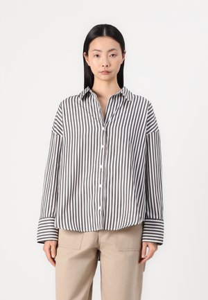 Striped button-up shirt featuring gray and white vertical stripes, a collar, and long sleeves with contrasting striped cuffs.