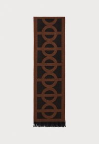 Brauner Schal mit einem geometrischen Kreismuster in dunklerem Braun, mit fransigen Enden, aus einem weichen, strukturierten Material gefertigt.