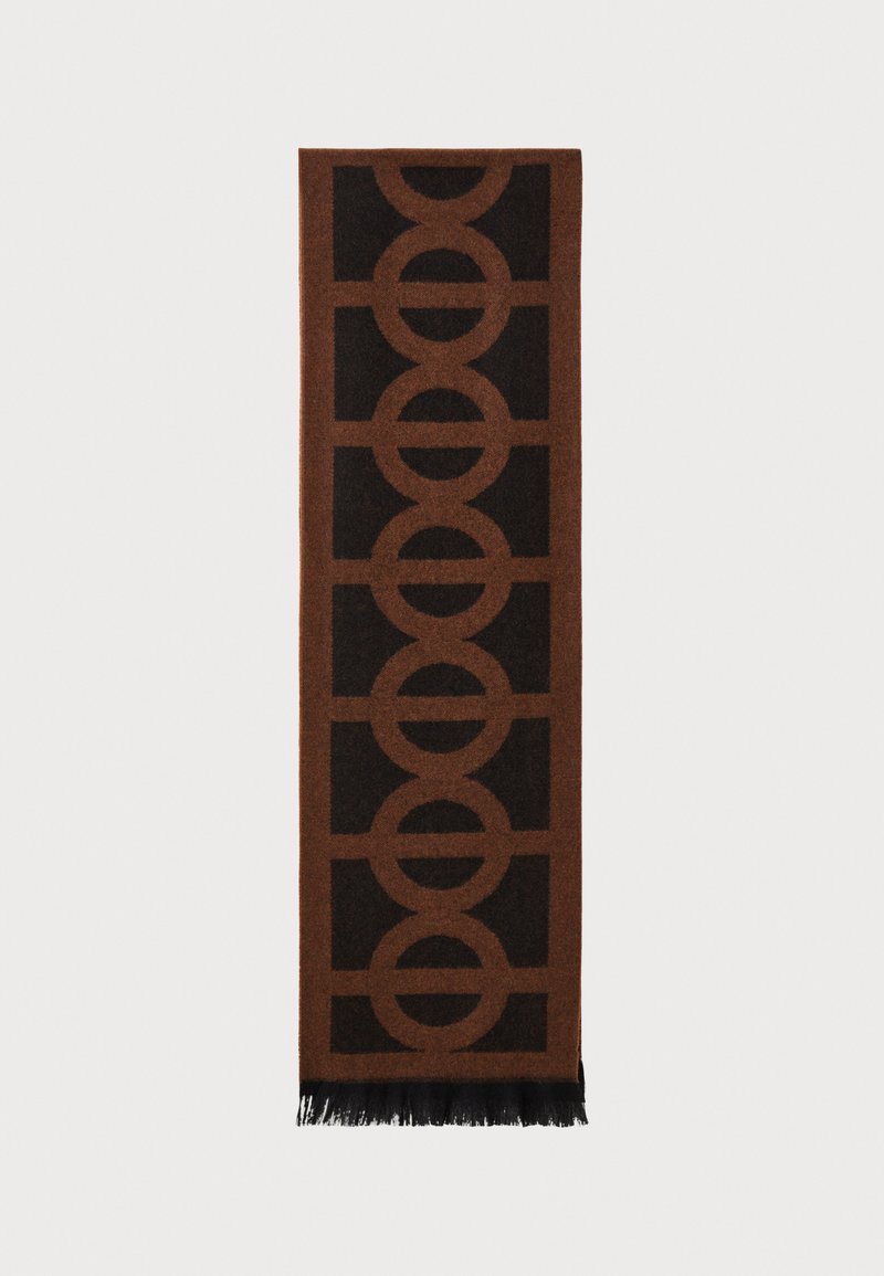 Cachecol castanho com um padrão geométrico circular em castanho mais escuro, com extremidades franjadas, feito de um material macio e texturado.