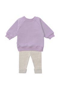 Purple sweatshirt with ribbed cuffs and hem, paired with light gray leggings featuring a textured pattern and rolled cuffs.