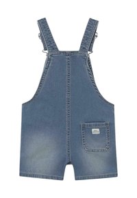 Mono de mezclilla en azul claro, con tirantes ajustables, un bolsillo frontal y textura deslavada. Confeccionado con material de mezclilla resistente.