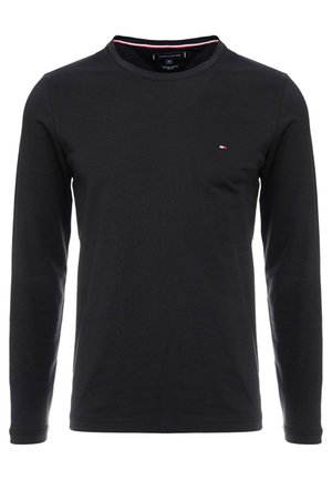 Tricou negru cu mânecă lungă, realizat din bumbac moale, cu guler rotund și un logo mic în roșu, alb și albastru pe piept.
