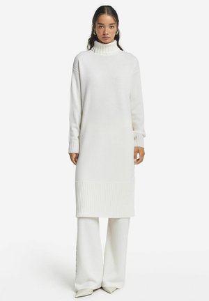 Stickad klänning - white