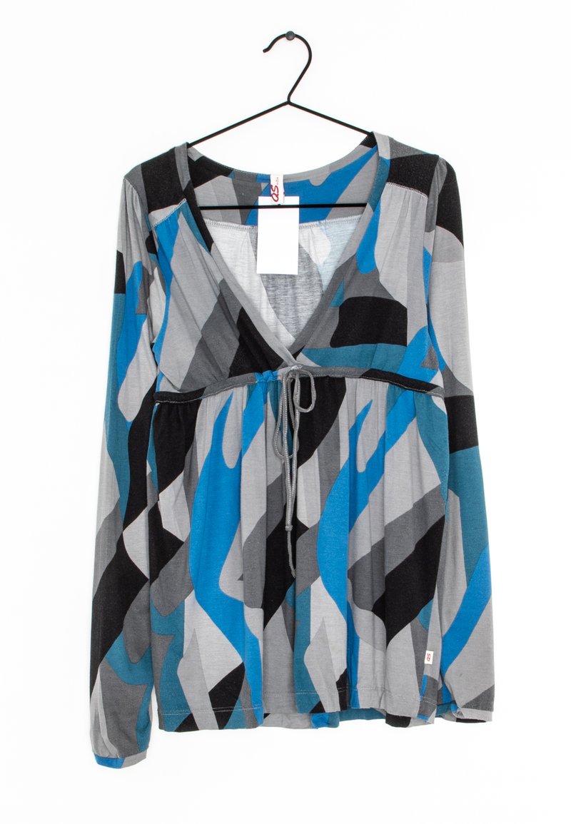 Long-sleeve gray top with blue and black abstract patterns, V-neck, adjustable drawstring waist, and a tag attached.