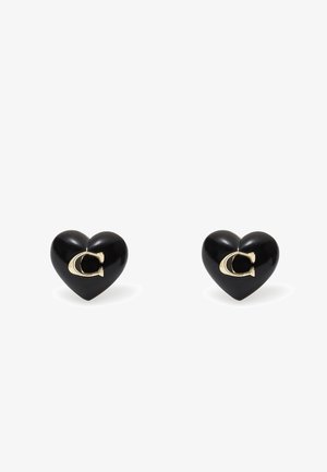 Black heart-shaped earrings made of glossy material, featuring a gold accent in the shape of a "C" on one side.