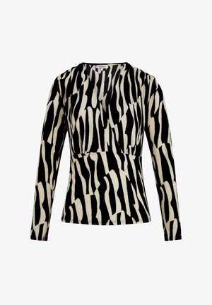 Maglietta a maniche lunghe con un motivo a strisce zebra in bianco e nero. Presenta un design a scollo a V e una silhouette aderente per un aspetto snello.