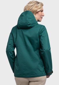 Türkisfarbene, wasserdichte Jacke mit Kapuze, glatter Textur und verstellbaren Bündchen. Entwickelt für den Einsatz im Freien, mit einem lockeren Schnitt und minimalen Nähten.