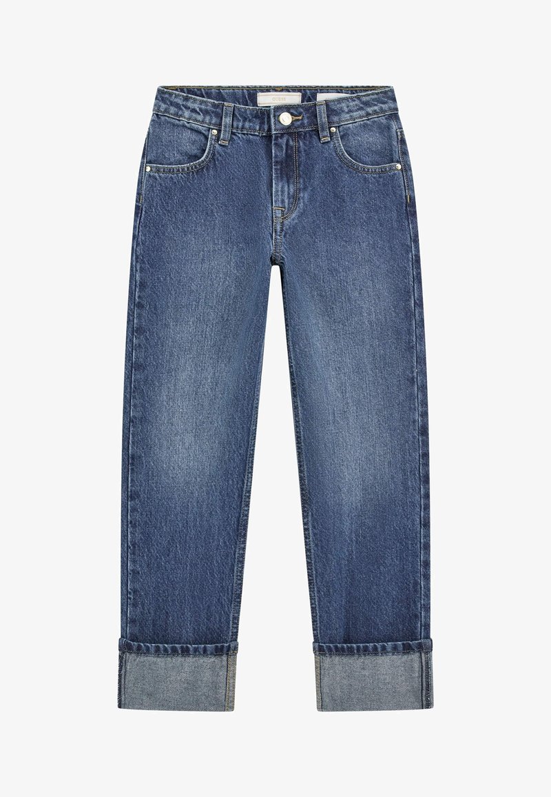 Tamne traperice tamnoplave boje, s ravnim nogavicama, stilom s pet džepova i preklopljenim manžetama. Tkanina ima izgužvanu teksturu.