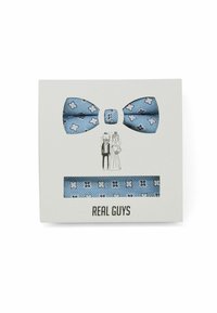 Blue-patterned bow tie and matching strap, featuring floral motifs on textured fabric, presented in a minimalist white box with illustrations.