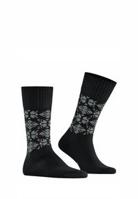 Schwarze Socken mit einem gerippten oberen Teil, die ein geometrisches grau und cremefarbenes Muster entlang des Beins aufweisen, aus einem weichen, dehnbaren Material gefertigt.