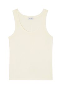 Cremfarbener ärmelloser Tanktop mit U-Boot-Ausschnitt und kleinem Markenlabel innen am Rücken.