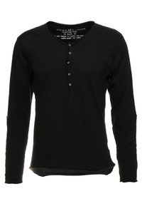 Zwarte longsleeve shirt met een V-hals, voorzien van een vijfknops bij sluiting en een licht gebogen zoom. Zachte stof met een effen textuur.