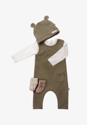 Olive green corduroy overall with white long-sleeve shirt, accented by 2-button shoulder, pocket detail, and 3 pairs of socks in soft colors.