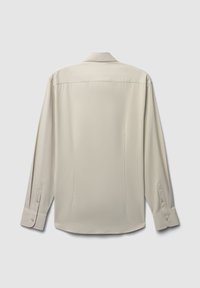 Camicia a maniche lunghe beige chiaro con colletto, polsini abbottonati, texture liscia e fondo dritto. Nessun motivo visibile.