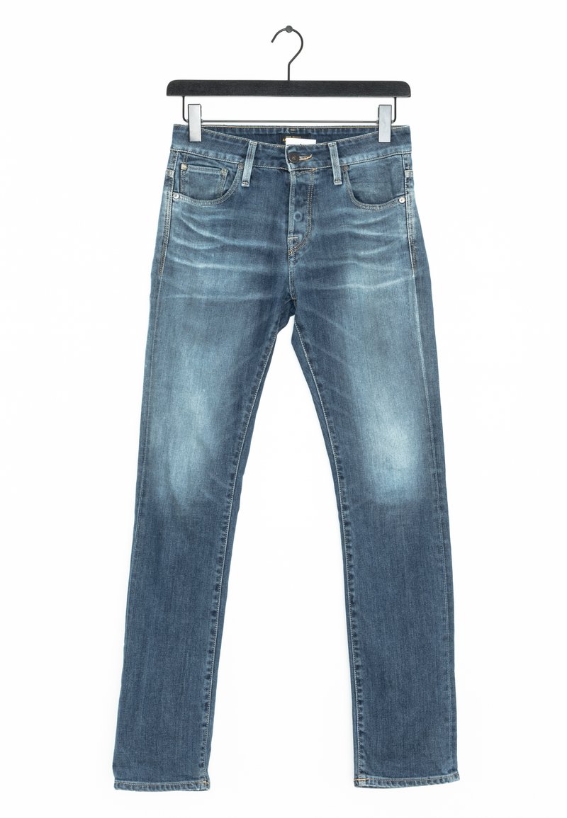 Blue denim jeans with slight fading on thighs and knees, hanging on a black hanger against a white background.