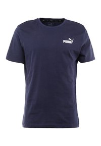 Tmavě modré bavlněné tričko s kulatým výstřihem, krátkými rukávy a bílým logem a grafikou Puma na levé hrudi. Hladká textura.