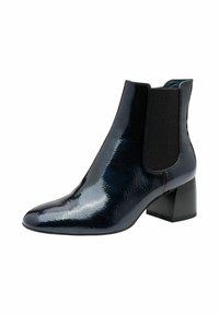 Bottine noire avec une finition vernie brillante, des panneaux latéraux élastiques, un bout pointu et un talon bloc pour plus de stabilité.