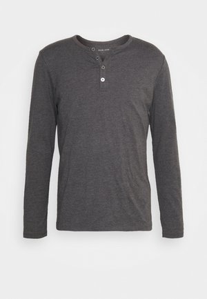 Long-sleeve, dark gray henley shirt made from soft fabric, featuring a rounded neckline, three-button placket, and regular fit.
