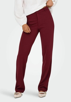 Bordeauxkleurige op maat gemaakte broek met een rechte pijp, gemaakt van een zachte stof. De broek heeft een vlakke voorkant en discrete zijzakken.