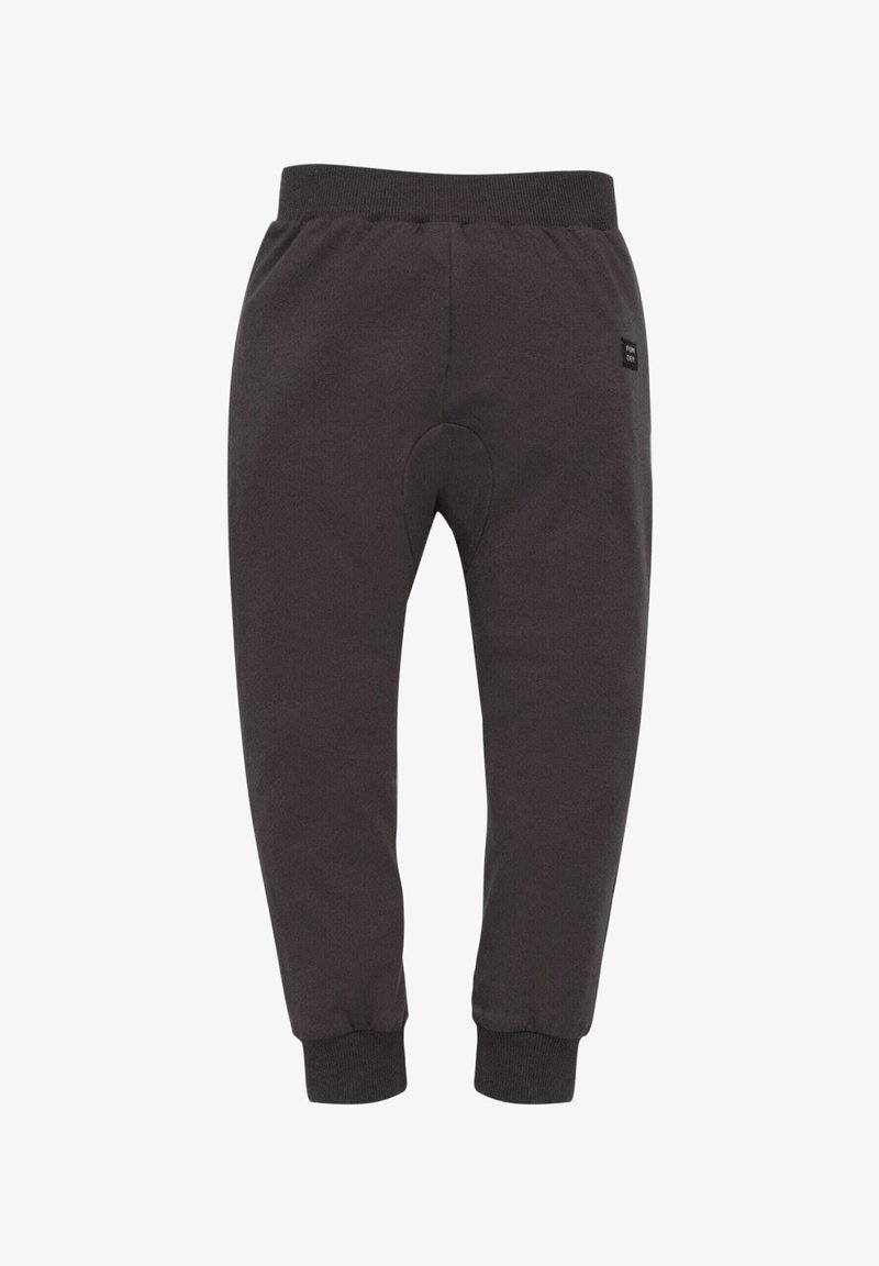 Mørkegrå sweatpants lavet af blødt stof, med en elastisk talje, tapered manchetter og et lille logo mærke på siden.
