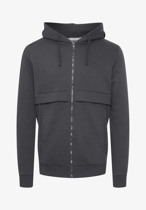 Hallisutest riidest hall tõmblukkhoodie, millel on kapuuts. Omab kahte eesmist taskut, soonikuga varrukaid ja tekstureeritud paneeli rinna peal.