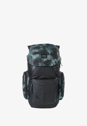Backpack made of black and green camo fabric, featuring a top flap, zippered compartments, and side pockets. Durable and padded design.
