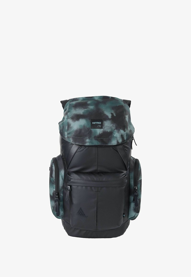 Backpack made of black and green camo fabric, featuring a top flap, zippered compartments, and side pockets. Durable and padded design.