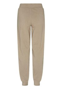 Beige Jogginghosen aus weichem Stoff, mit einem elastischen Bund, schmal zulaufenden Beinen und gerippten Bündchen an den Knöcheln.